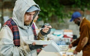 homeless-man-eating-charity-food-2022-08-06-18-11-46-utc